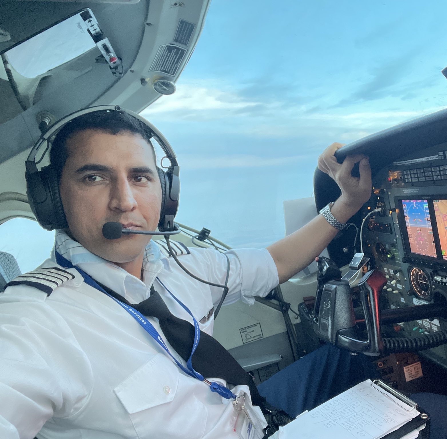 Yousuf in a cockpit of a plane